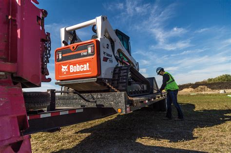 how to load skid steer onto a box truck|bobcat dump truck positioning instructions.